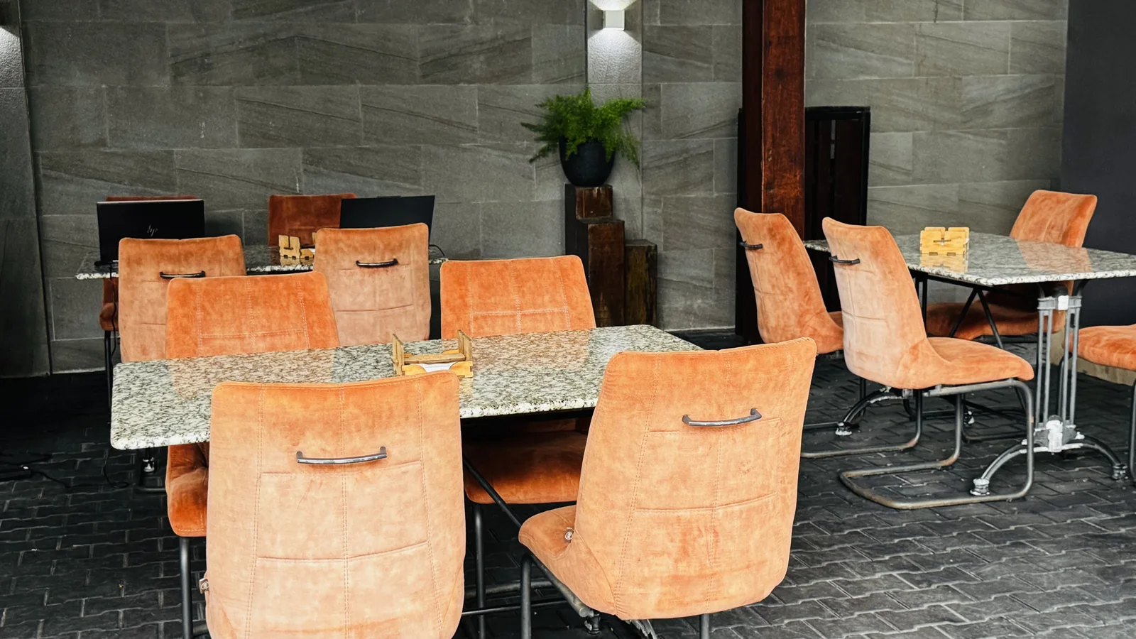 Tables and orange chairs in the Pavema restaurant
