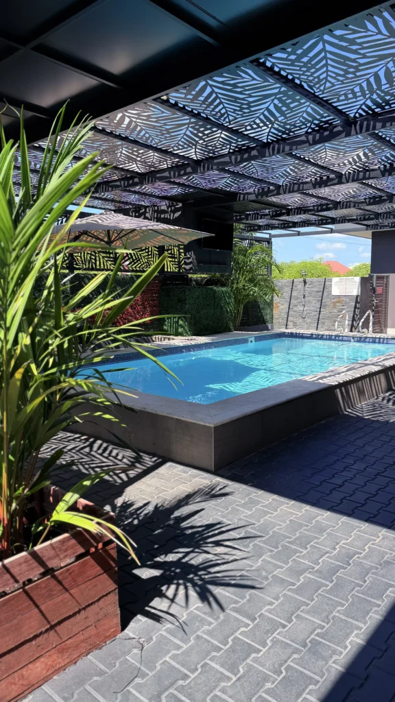 Pool surrounded by tropical planting